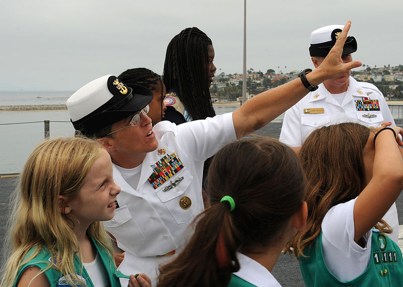800px-US_Navy_110728-N-DO220-017_Command_Master_Chief_Susan_Whitman_speaks_with_the_Girls_Scout_Troop_1111_about_the_ship's_aircrafts_during_a_tour_aboar.jpg