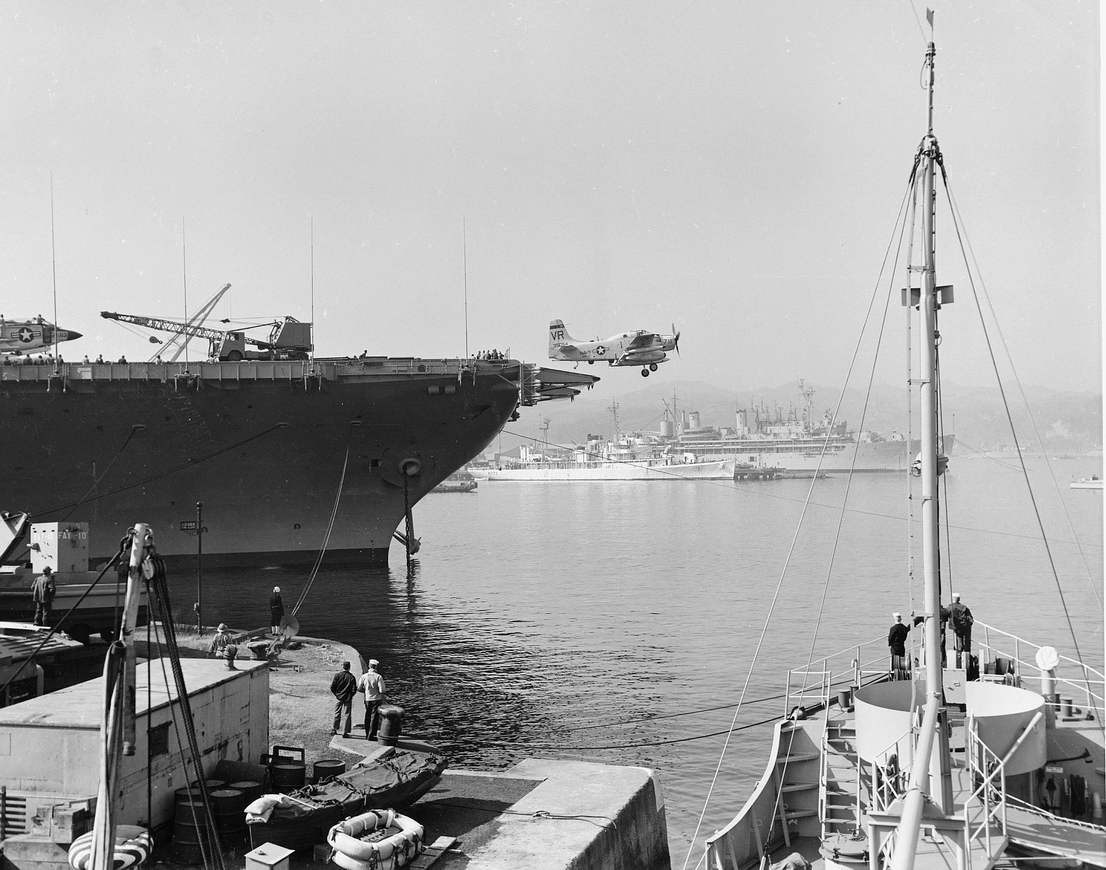 Douglas AD-4B Skyraider launching off USS Coral Sea (CV-43) in Yokosuka Hbr c 1950's.jpg