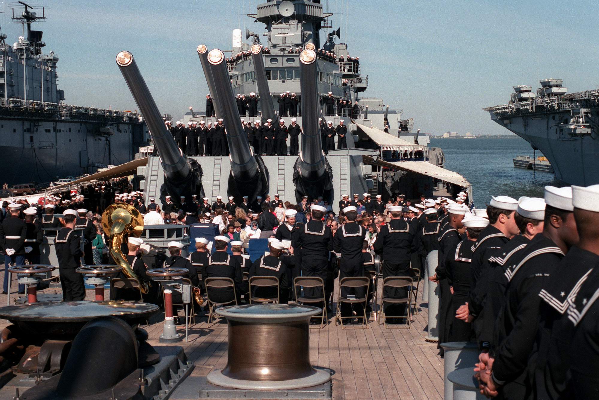 Families of 47 sailors killed in the April 19, 1989, explosion aboard the USS IOWA (BB-61) attend a shipboard ceremony with the IOWA's crew on the one-year anniversary of the explosion.jpg